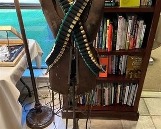 Two leather bandoliers on a vintage dress form