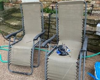 Two outdoor lounging chairs