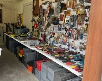 On the far right of the shop. Brand new stuff hanging on the pegboard. Lots of nice, like new hand tools on the tables and empty tool boxes under the tables.