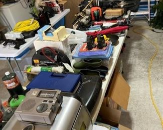 Left side of the garage has a lot of camping equipment!