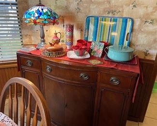 Wonderful sideboard with lots of storage, stained glass table lamp, ceramics