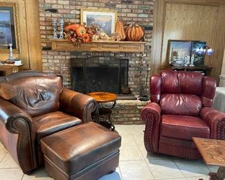 On the left is the  leather chair and footstool which matches the leather sofa. The leather recliner on the right. In the background you will see copper style pumpkins, Fall floral, and a Kinkade print "The Village Light House" metal fire guard and copper hearth guard