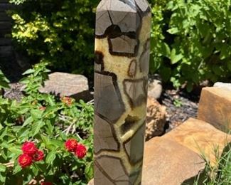 Septarian Nodule, also referred to as Dragon Stone, is a tri color concretion composed of Aragonite (the brown), Calcite, (the yellow), and Limestone (the grey). This unique mineral was formed around 50 to 70 million years ago during Earth’s Cretaceous Period.