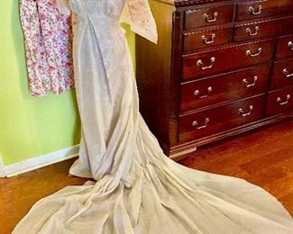 A vintage long dress with detachable train and with a veil. 