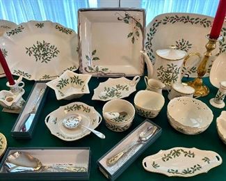 A table full of Lenox Holiday pattern dinnerware and serving pieces 
