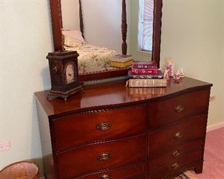 Serpentine front mahogany dresser with mirror by Bassett