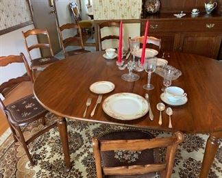 Furniture: Antique walnut dining room table with six antique walnut chairs all with needlepoint seats. Additional leaves for table leaf and protective glass top not shown. Walnut hutch. Three sets of china. Multiple cut glass items and glasses.