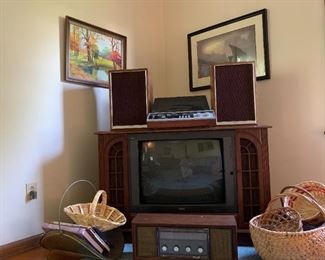 RCA 27" TV console (30" x 45" x 18.5"), AM/FM vintage table radio, several baskets, firewood/magazine holder, artwork, SOLD: Technics turntable stereo,