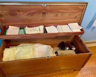 Lane Cedar Chest (19H x 47W x 18D), embroidered towels, lace and embroidered table cloths