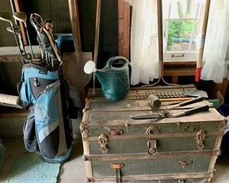 Vintage travel trunk, glove clubs and bag, misc gardening tools