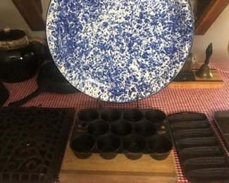 Large blue and white enamel tray 
Griswold Muffin pan 
Wooden cutting board 