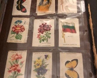 Tobacco silks circa 1920 from Ziha Cigarettes featuring a gypsy, butterflies, flowers, flags. Will be offered auction style at the live stream sale. 