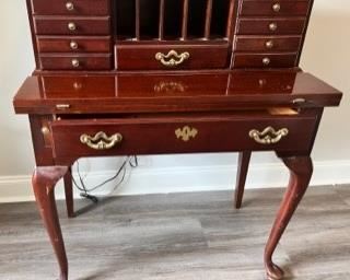 Thomasville solid cherry secretary desk with hinged pull out writing shelf. 