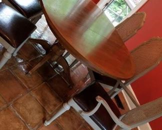 dining table with 4 chairs and one leaf (shown with leaf in, remove and table is round)