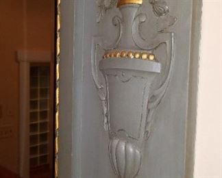 large, ornate mirror, pictured over mantle