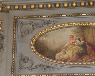 large, ornate mirror, pictured over mantle