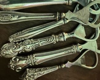 Collection of antique sterling silver handles converted to bottle openers 