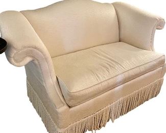 One of a pair of small sofas 