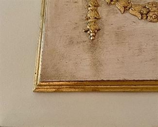 detail of wooden plaque above a doorframe 