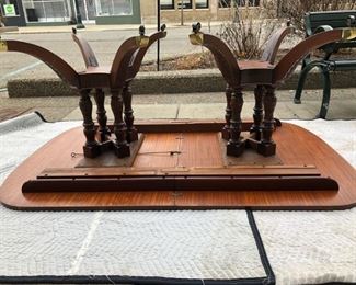 Shown upside down, Baker Mahogany dining table, double pedestals w/castors  - comes with 3 extensions, and matching chairs