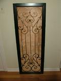 I think this originally had a mirror in it, but were it mine, I'd take out the wood backing and hang it on the wall for an interesting architectural element, or hang in a vertical window