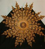 Neat wood carving of a huge snowflake!