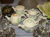 These are Belleek mini teapots in the four seasons
