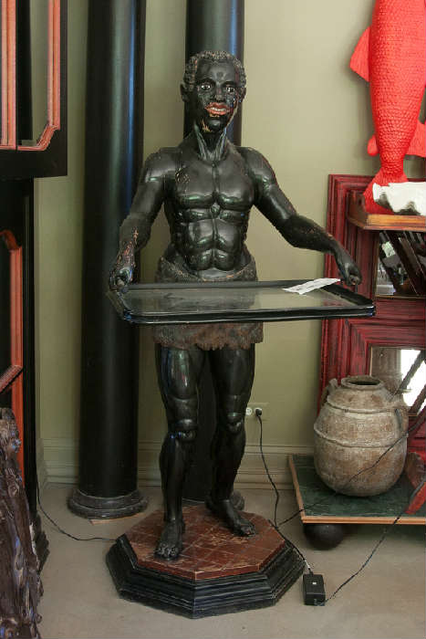 Interesting Sculpture from Africa.  The homeowner used the tray to hold his printer.  How could you use it?