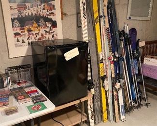Mini fridge skis and boots twin bed frame side table vintage games