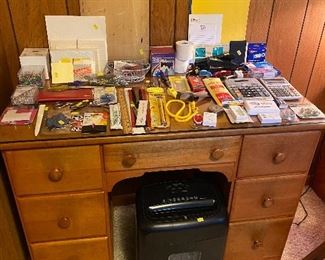 Maple desk paper shredder office supplies calculators rulers note cards paper clips