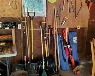 Shovels outdoor chairs rakes yard tools