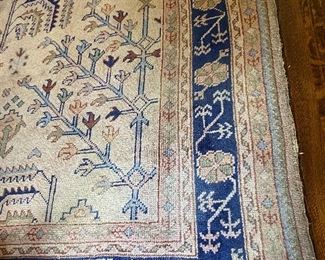 Large oriental rug with blue border 