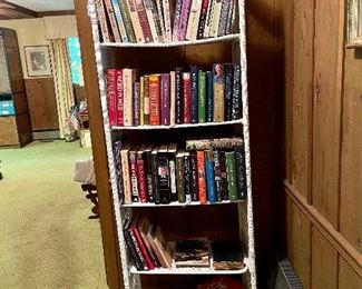 Vintage white wicker shelf full of good reads!