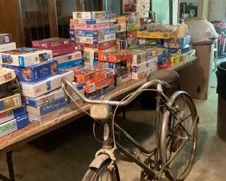 Over 100 puzzles, antique china cabinet