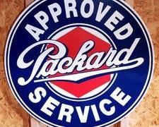 25-1/2" Round Reproduction Packard Approved Service Metal Sign in used condition