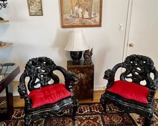 Pair of Chinese Ebonized Hardwood Chairs Depicting Dragons with Red Cushions