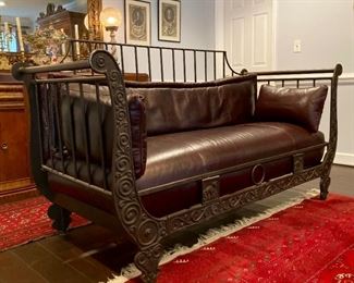 Metal frame sofa with leather cushions