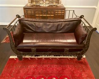 Metal frame sofa with leather cushions
