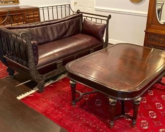 Metal frame sofa with leather cushions and vintage Art Deco wood inlay coffee table