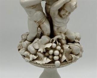 Vintage porcelain cherub and fruit statue