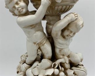 Vintage porcelain cherub and fruit statue