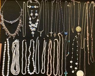 Lots of upscale and elegant costume jewelry; necklaces, rings, earrings, bracelets, brooches