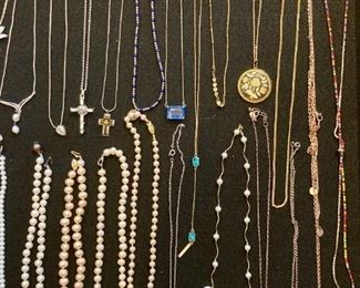 Lots of upscale and elegant costume jewelry; necklaces, rings, earrings, bracelets, brooches