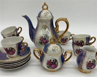 Vintage Lusterware Demitasse musical set; 6 cups with saucers, creamer, sugar and musical teapot