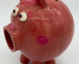 Pink glazed pottery piggy bank