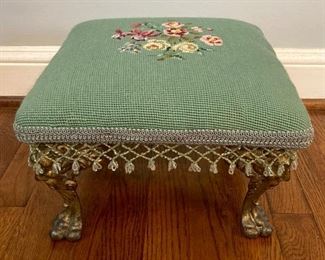 Vintage cast brass lion footed floral upholstered footstool
