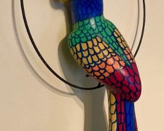 Colorful bird on perch wall hanging
