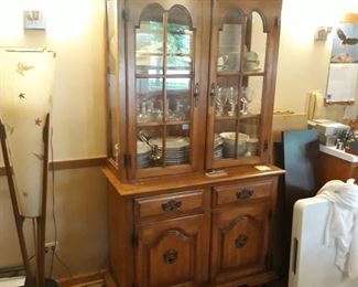 Storage cabinet glass panel doors and  sides with interior lighted 