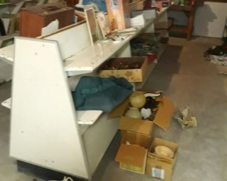 Three  two sided metal shelf units