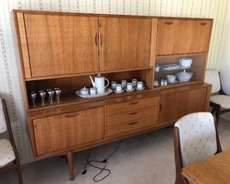 China buffet has drop down bars and tambour doors. Great condition for age.